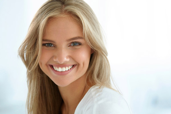 Young woman smiling at Placentia Oral Surgery in Placentia, CA