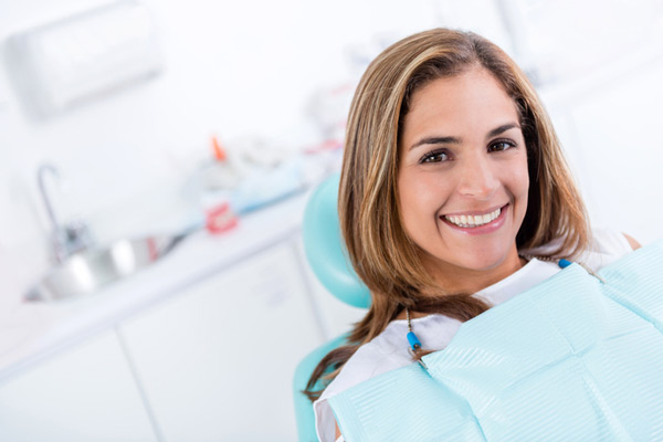 Smiling woman with mini dental implants from Placentia Oral Surgery in Placentia, CA Smiling woman with mini dental implants from Placentia Oral Surgery in Placentia, CA