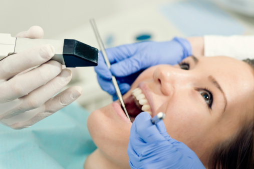 Female patient of Placentia Oral Surgery getting a dental exam in Placentia, CA